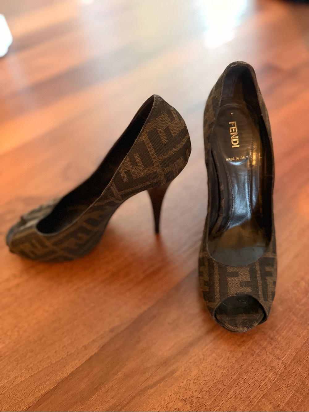 Fendi Zucca peep-toe stiletto pumps in iconic brown FF monogram canvas.